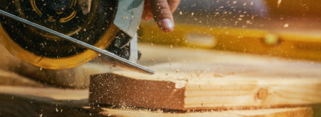 Carpenter Using Circular Saw for wood beam